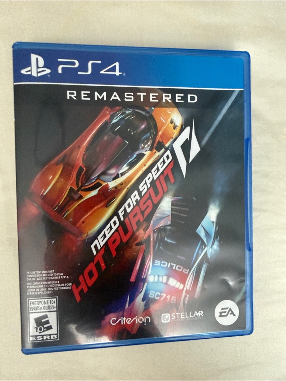 Sony PS4 Need for Speed Hot Pursuit Remastered – Blue Case, Orange Car Art